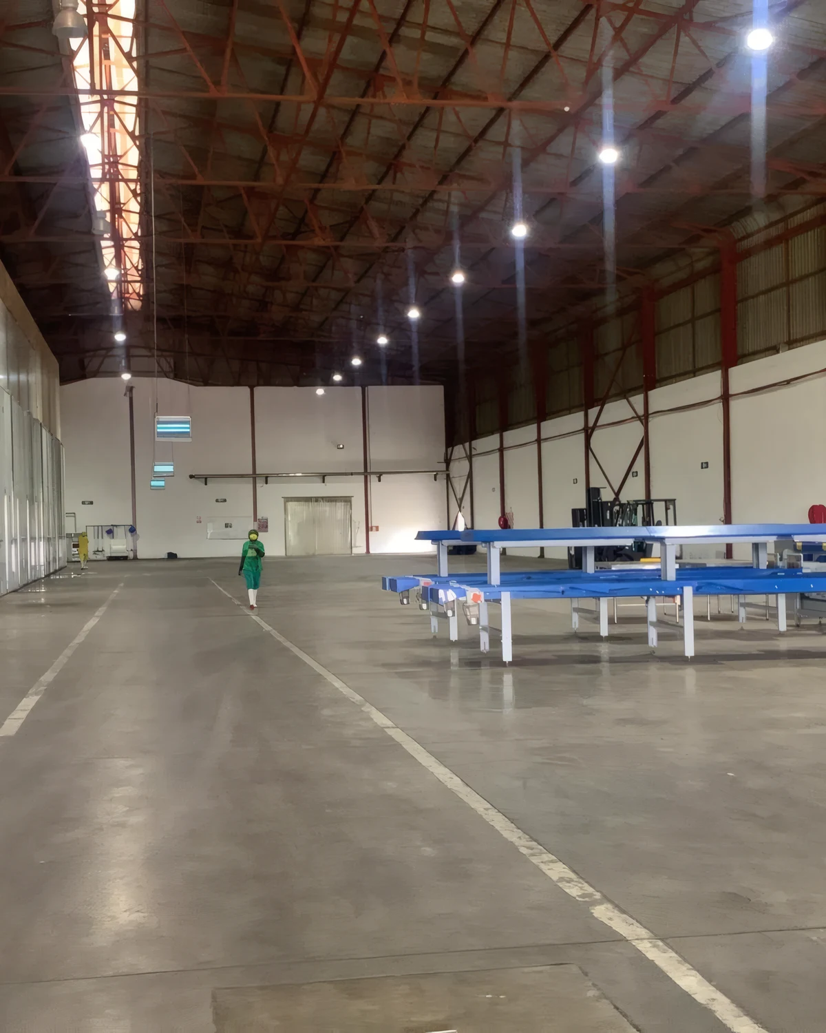 Inside the Malawi AgTech Center: a long processing hall with cold-room doors and packing lines